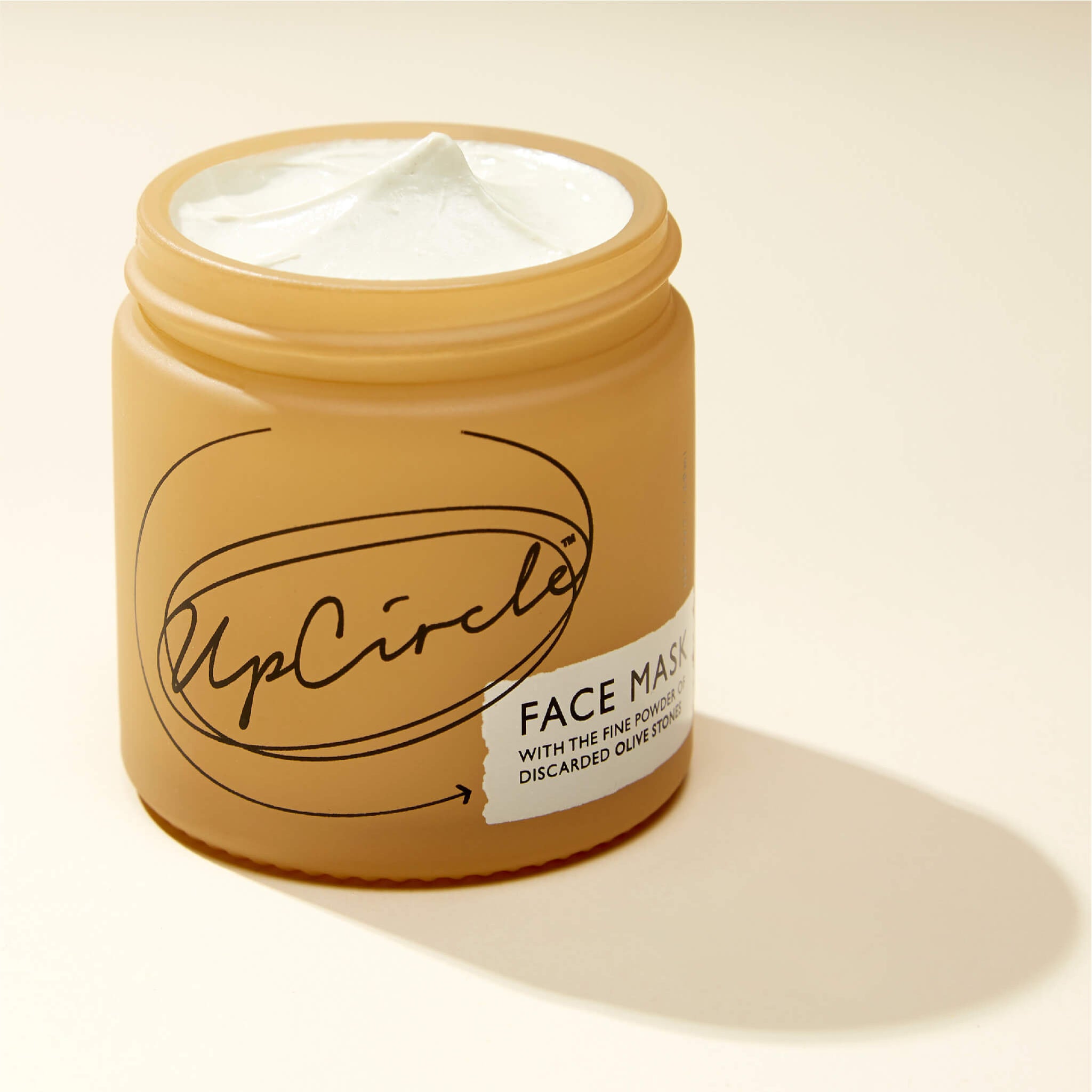 UpCircle face mask jar opened without its lid.